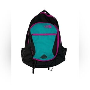 The North Face Pivoter black, pink, teal backpack.